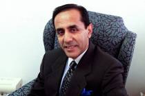 Dr. Ikram U. Khan sits for a photo in his ֱ office Wednesday, July 24, 2002. (Christine ...